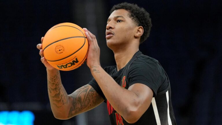 Angel Reese reacts as Los Angeles Lakers signal undrafted free agent Julian Reese, brother of WNBA All-Star