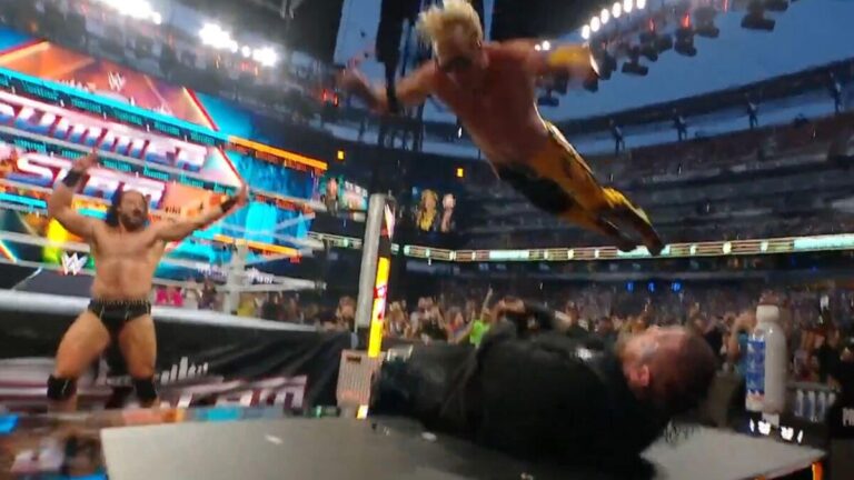 Watch as Logan Paul flies by the air and smashes Jelly Roll by an announce desk at WWE SummerSlam