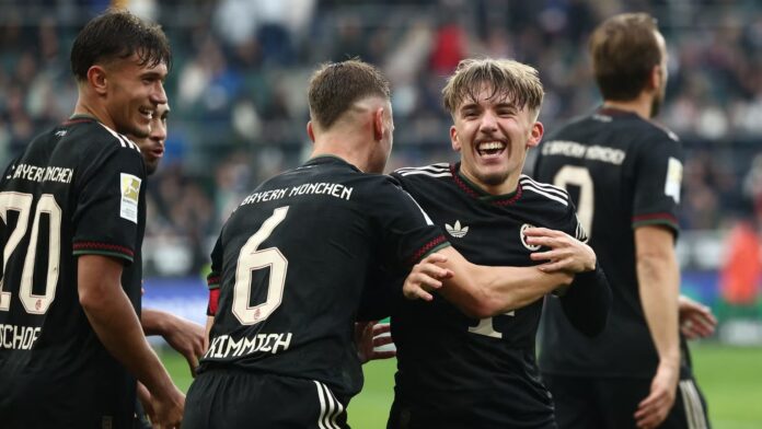 bayern-munich-s-lennart-karl-celebrates-scoring-their-third-goal-with-joshua-kimmich.JPG