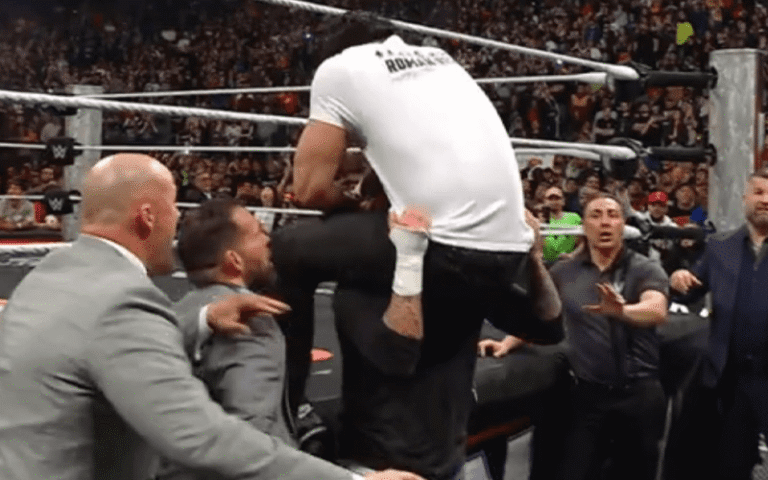 CM Punk Powerbombs Roman Reigns By Announce Desk Throughout 3/30 WWE RAW